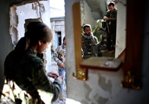 Kurdish fighters in the besieged Syrian city of Kobani prepare to fight against ISIS on November 7. The Kurds are receiving U.S. military aid. (Ahmed Deeb/AFP/Getty Images)
